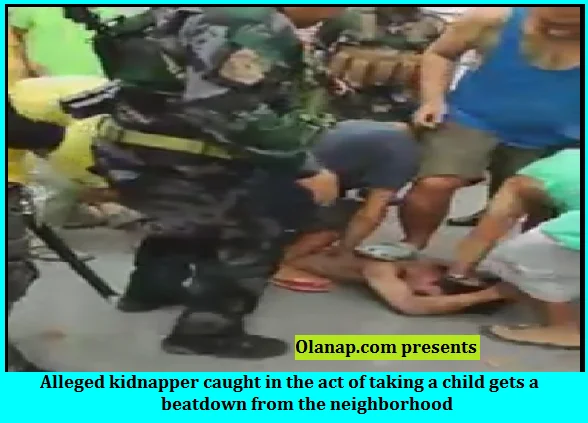 Alleged kidnapper caught in the act of taking a child gets a beatdown from the neighborhood